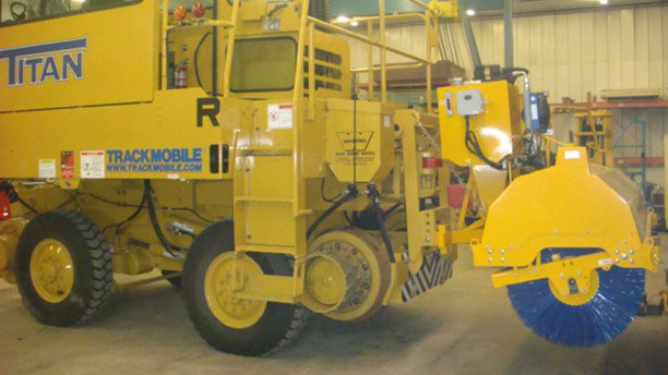 Eddynet Front-Mounted Hydraulic Sweeper Attachment for loader or backhoe.